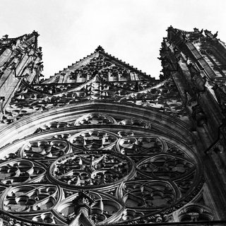 Ornate Gothic cathedral architecture with a detailed rose window.
