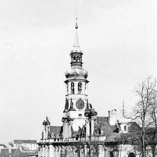 Black and white photo of a building and street scene.