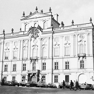 Black and white photo of a grand, ornate building facade.