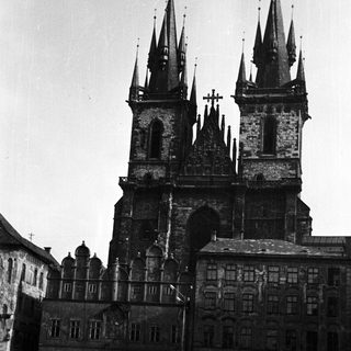 Black and white photo of a historic building with towers.