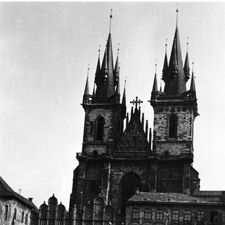 Black and white photo of a historic building with towers.