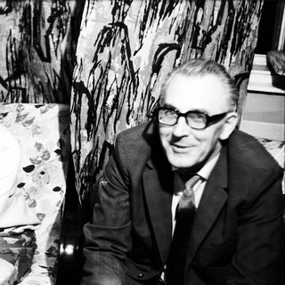 Black and white portrait of a man and woman seated.