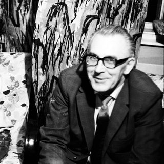 Black and white portrait of a man and woman seated.