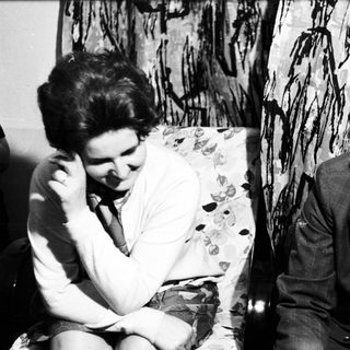 Black and white portrait of a man and woman seated.