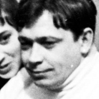 Three people sitting in chairs, appearing to be in a room.