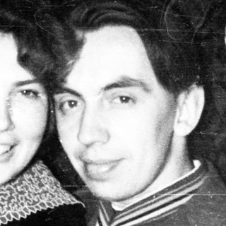 Vintage portrait of a couple standing close together.