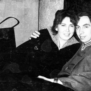 Vintage portrait of a couple standing close together.