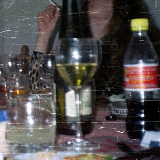 People seated at a table with food and drinks.