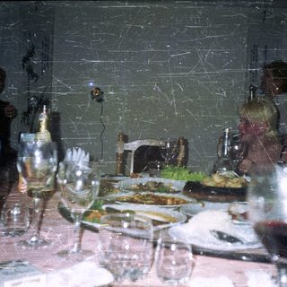 Celebratory dinner with drinks and food on a table.