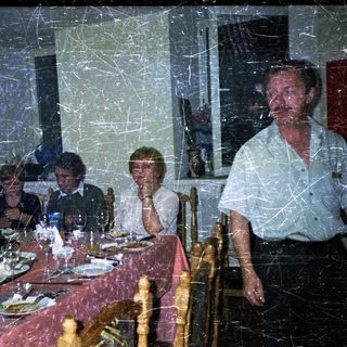 Group seated at a table, appears to be dining.