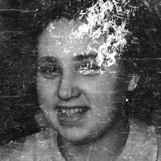 Here's a brief summary of the image: Pair of people in a black and white portrait.