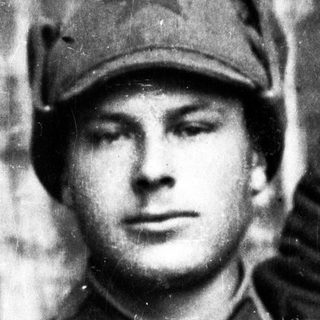 Man in military uniform and cap, black and white photo.