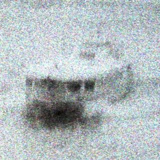 Monochrome image of vehicles partially submerged in floodwater.