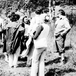Group of people in a field, likely in the 1970s.