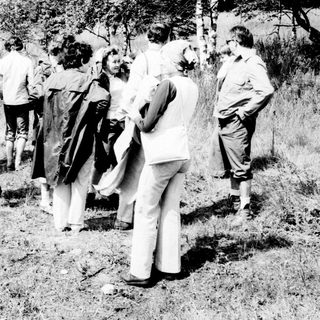 Group of people in a field, likely in the 1970s.