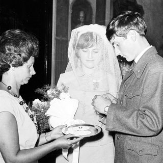 Couple receiving refreshments at a wedding reception.