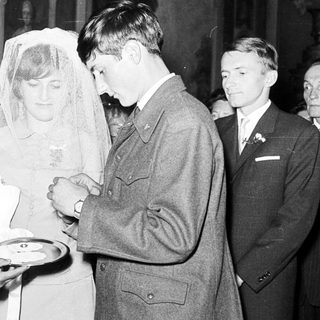 Couple receiving refreshments at a wedding reception.