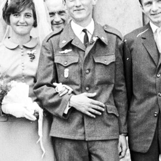 Black and white photo of a wedding party outside.
