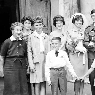 Black and white photo of a wedding party.