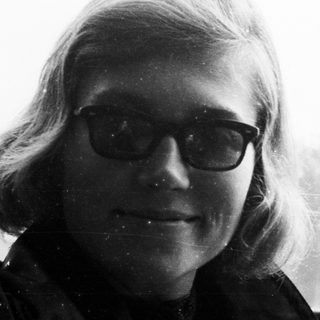 Black and white portrait of a man with glasses.
