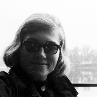 Black and white portrait of a man with glasses.