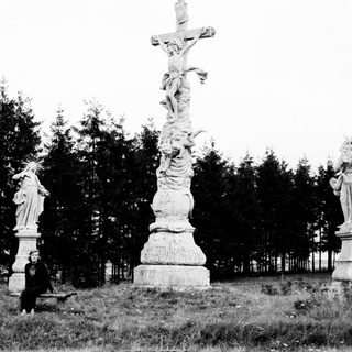 Black and white image of a religious statue scene.
