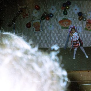 Puppet show performance on stage with audience.