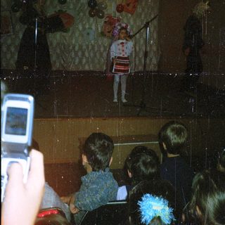 People viewing a zombie-themed window display.