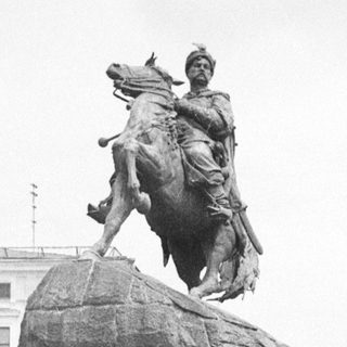 Equestrian statue of a historical figure on a stone pedestal.
