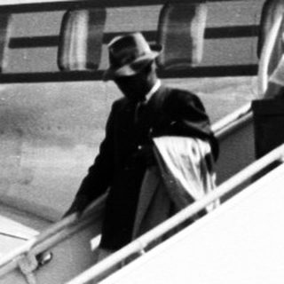 Passengers boarding Ethiopian Airlines plane via staircase.