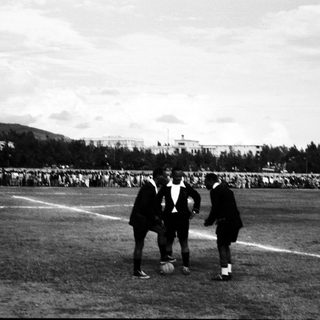 Historic soccer match with players and spectators.