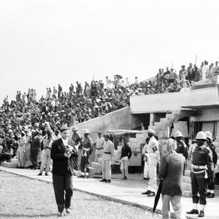 Mass gathering with military presence during public event.