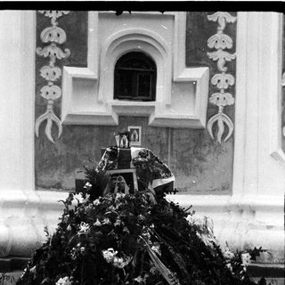 Memorial wreath with flowers and tributes.