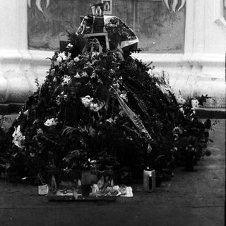 Memorial wreath with flowers and tributes.