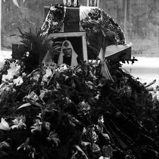 Religious float with statue during procession.