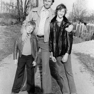 Family portrait outdoors in vintage clothing.