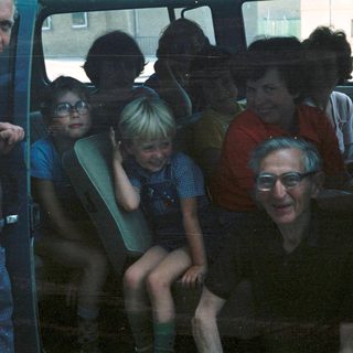 Family group traveling together in a van.