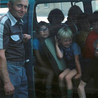 Family group traveling together in a van.