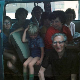 Family group traveling together in a van.