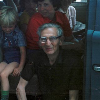 Family group traveling together in a van.