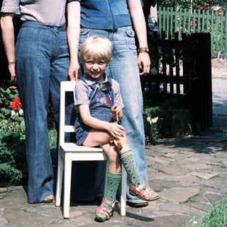 Family portrait in garden, mid-1980s style.