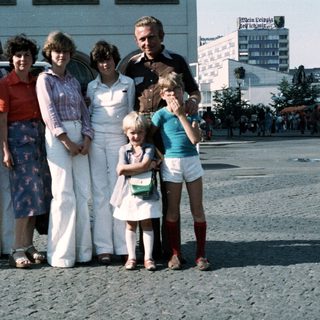 Family group photo from the 1980s outdoors.
