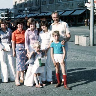 Family group photo from the 1980s outdoors.