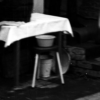 Blurred motion shot of man and child near doorway.