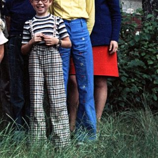 Family group photo with Volkswagen van, 1970s-80s.