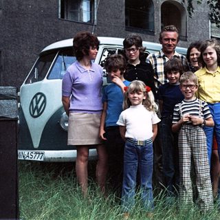 Family group photo with Volkswagen van, 1970s-80s.