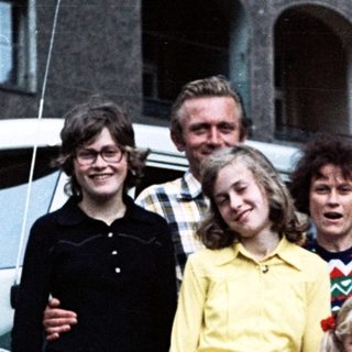 Family group photo with vintage Volkswagen van.
