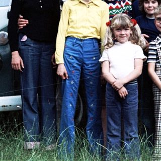 Family group photo with vintage Volkswagen van.