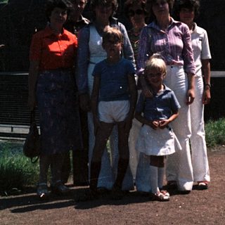Family group photo near industrial monument.