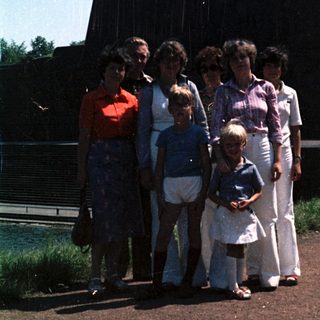 Family group photo near industrial monument.